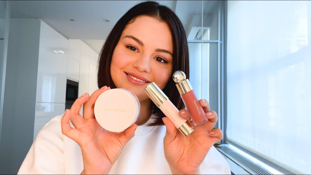 Selena Gomez using Rare Beauty products