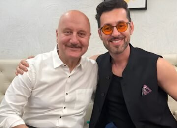 A Heartwarming Moment: Anupam Kher Gifts Jacket to Max Amini, Who Responds ‘Jai Ho’