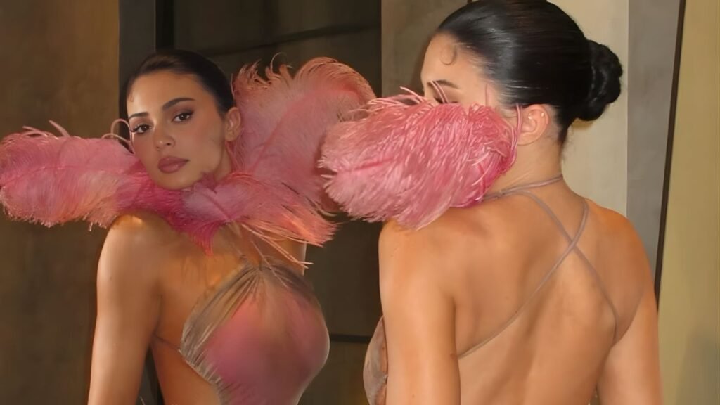 Kylie Jenner Stuns in Pink Feathered Dress at Kylie Cosmetics Christmas Party