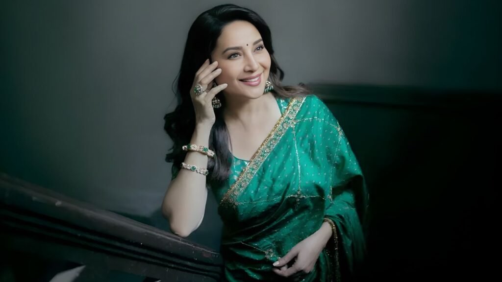 Madhuri Dixit Redefines Wedding Glamour in Bottle Green Saree