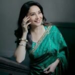 Madhuri Dixit Redefines Wedding Glamour in Bottle Green Saree