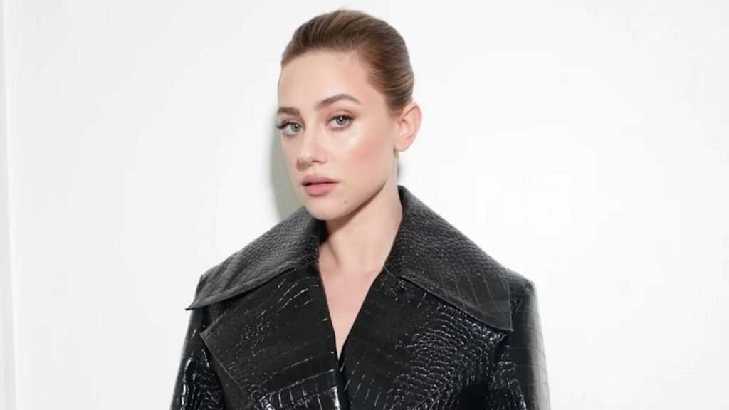 Lili Reinhart Turns Heads in Crocodile-Effect Patou Trench at Paris Fashion Week