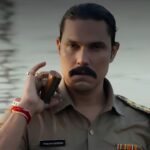 Inspector Avinash Season 2 trailer is finally out, and it promises a far more intense, emotional and explosive chapter in the crime thriller franchise. Led by Randeep Hooda, the upcoming season raises the stakes with bigger action, personal conflict and a dangerous nexus of crime, politics and corruption. After the strong response received by the first season, fans had been eagerly waiting for the next chapter. Going by the newly released trailer, the wait looks worth it. This time, Inspector Avinash Mishra is not only fighting criminals but also battling threats that hit dangerously close to home. Inspector Avinash Season 2 Trailer Promises High-Stakes Drama The trailer opens in the tense landscape of 1990s Uttar Pradesh, instantly setting the gritty tone of the series. It wastes no time in showing that Avinash Mishra is entering the most difficult phase of his life. His son is implicated in a murder case. His marriage is under severe strain. Meanwhile, powerful enemies are closing in from every direction. Unlike the first season, where Avinash largely fought external threats, the second season appears far more personal. The emotional stakes are clearly deeper, making this story feel bigger than a standard action thriller. Randeep Hooda Returns In Powerful Form Randeep Hooda once again steps into the role of Inspector Avinash Mishra, and the trailer suggests another commanding performance. Known for bringing intensity and realism to his characters, Hooda appears fully in control of the role. His screen presence, restrained anger and emotional weight give the trailer much of its impact. Speaking about the new season, the actor shared that this chapter strips Avinash down to his core. He is now fighting for family, truth and survival rather than simply enforcing the law. That shift could make the character more layered and emotionally compelling. Crime, Politics And Corruption Drive The New Story One of the strongest elements in the trailer is the expansion of the larger criminal world. This season introduces a more dangerous network involving crime lord Sheikh and the mysterious Devi. Together, they are shown building a deadly weapons cartel while manipulating power structures around them. As a result, the story goes beyond gang rivalry and police action. It enters a darker space where politics, betrayal and institutional corruption become central themes. This broader conflict can elevate the season into a more gripping and layered crime saga. Avinash Faces Betrayal From Within Perhaps the most dramatic twist teased in the trailer is that Avinash is not just targeted by criminals. He is betrayed from inside the system. The footage shows him suspended, arrested and isolated. This suggests that trusted allies may turn into enemies, while official systems become weapons against him. That kind of narrative often creates stronger tension because the hero has nowhere safe to turn. It also means Avinash may need to break rules or operate outside the system to survive. Strong Supporting Cast Adds Depth The series features a solid ensemble cast that can significantly strengthen the drama. Key Cast Members Include: Urvashi Rautela Amit Sial Abhimanyu Singh Rajneish Duggal Shalin Bhanot Freddy Daruwala Each actor brings a distinct screen presence, and their involvement hints at multiple subplots, layered conflicts and power struggles. Urvashi Rautela described the new season as bigger, bolder and more explosive, adding that every scene pushes the intensity further. Why The 1990s Setting Still Works The decision to keep the story rooted in 1990s Uttar Pradesh remains one of the series’ smartest creative choices. That era was marked by political instability, growing organised crime and shifting power centres. It naturally suits stories involving gang networks, corrupt systems and larger-than-life law enforcement figures. The period backdrop also adds texture through costumes, production design, vehicles and atmosphere, helping the show stand apart from present-day crime dramas. What Fans Can Expect From Season 2 Based on the trailer, viewers can likely expect: Bigger action sequences Emotional family drama Political conspiracies Suspenseful betrayals Powerful villain arcs Gritty 90s atmosphere Randeep Hooda in peak form This combination can help the new season appeal to both action lovers and fans of layered storytelling. Streaming Date Confirmed The makers have officially announced that Inspector Avinash Season 2 will premiere on JioHotstar on May 15. With the trailer now out, audience anticipation is expected to rise sharply over the coming days. Final Verdict Inspector Avinash Season 2 trailer successfully builds excitement by offering a darker, more personal and more explosive continuation of the story. Randeep Hooda looks intense, the stakes feel higher and the larger crime-political nexus adds serious intrigue. If the full season delivers on the promise of the trailer, this could become one of the most talked-about Indian crime thrillers of the month. For fans of hard-hitting action dramas with emotional depth, Inspector Avinash Season 2 looks like a must-watch.