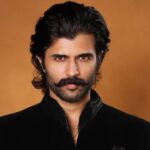 Vijay Deverakonda makes a regal statement in an all-black Amit Aggarwal ensemble for a wedding, styled by Harmann Kaur. See his latest fashion look.